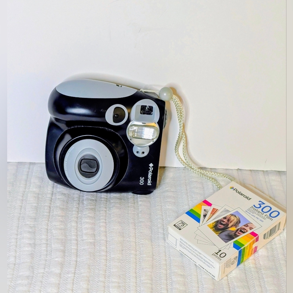 Polaroid 300 Instant Camera With A Pack Of Film